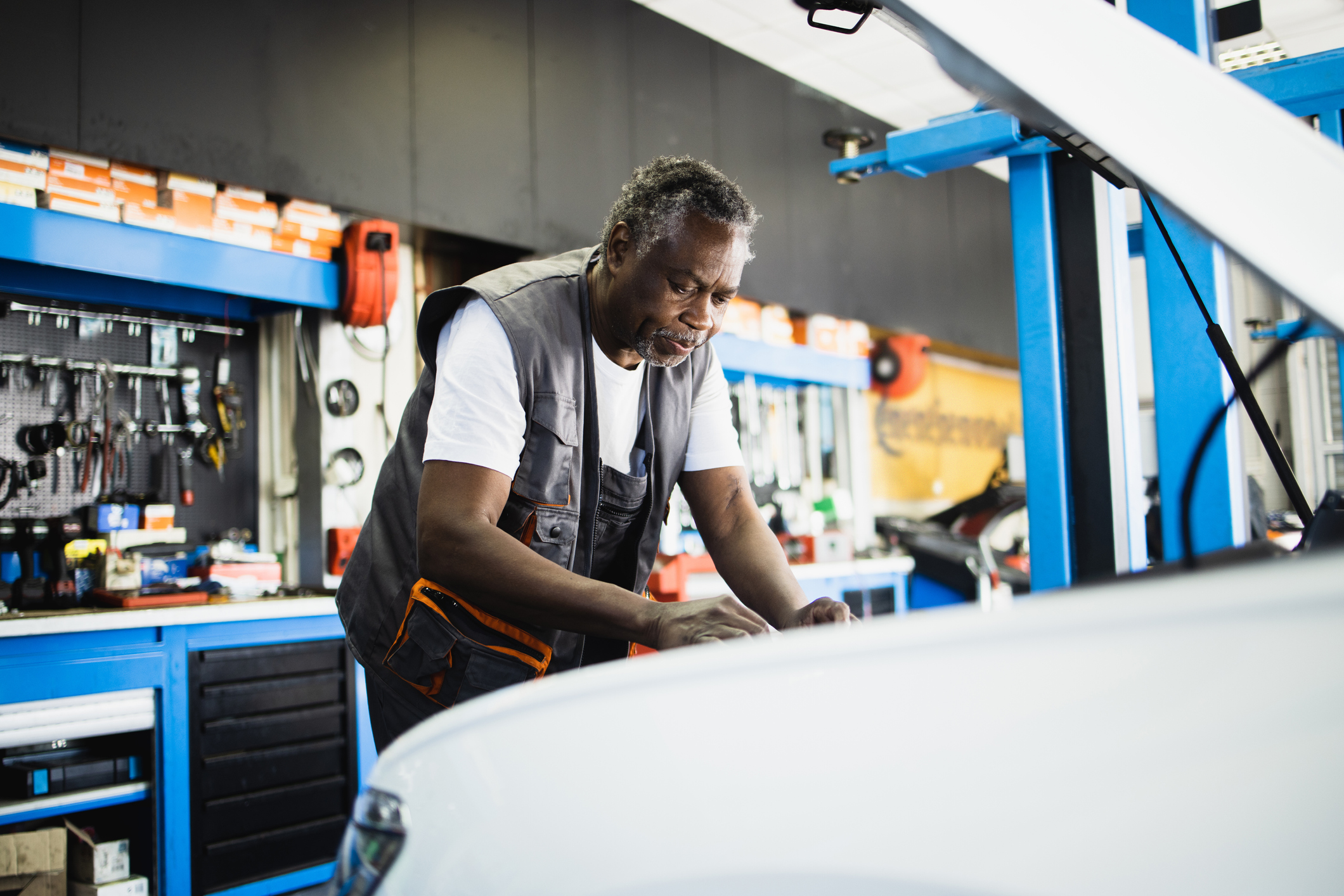 A mechanic working on a car