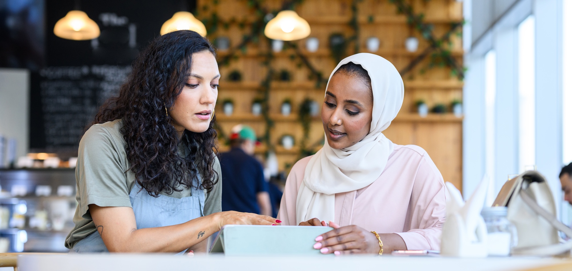 Two women are discusssing the contents of a report