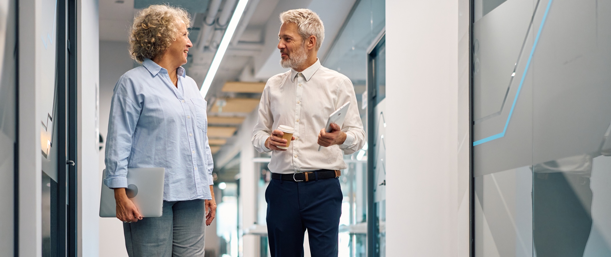 Two people talking in an office