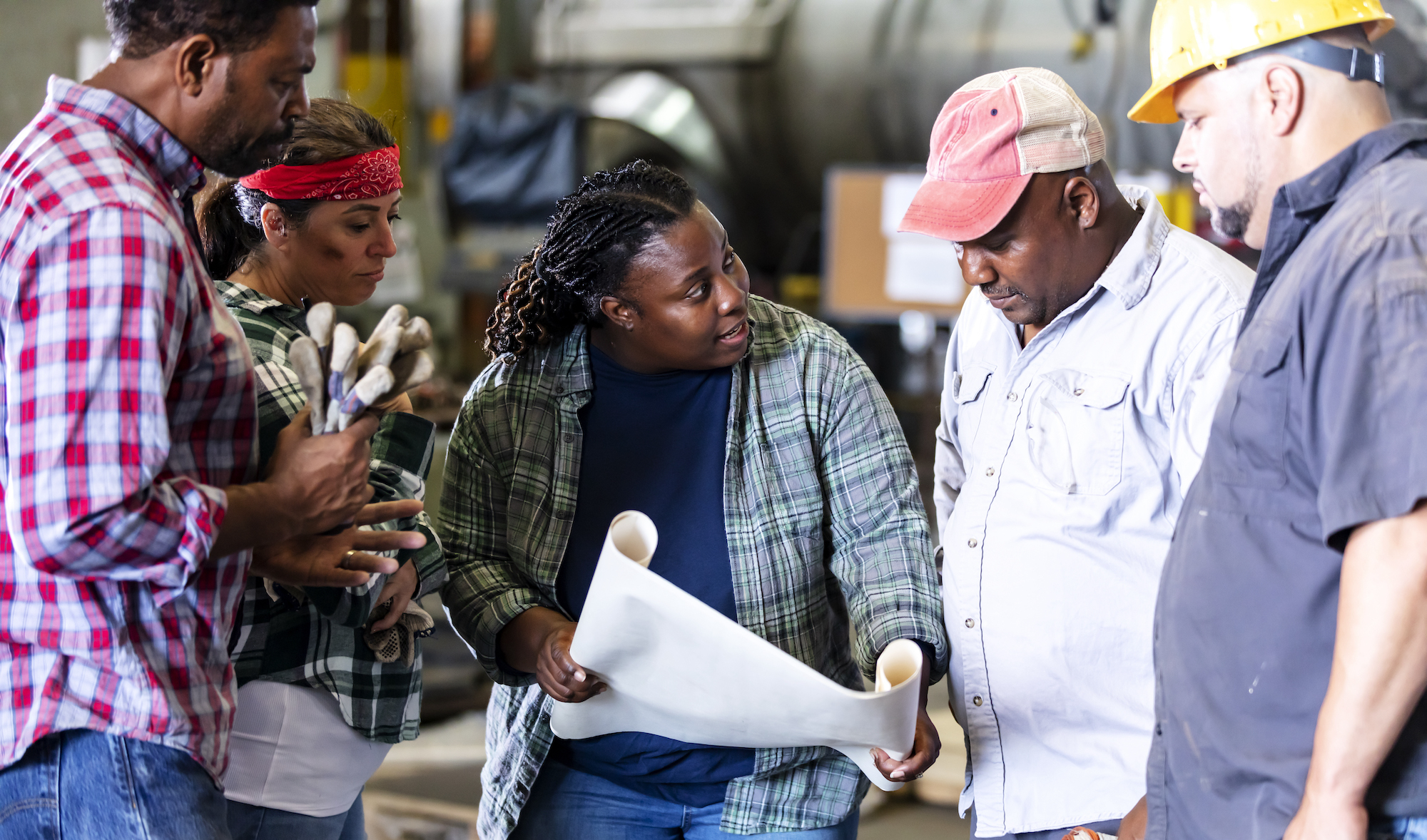 A group of construction workers discussing a project.