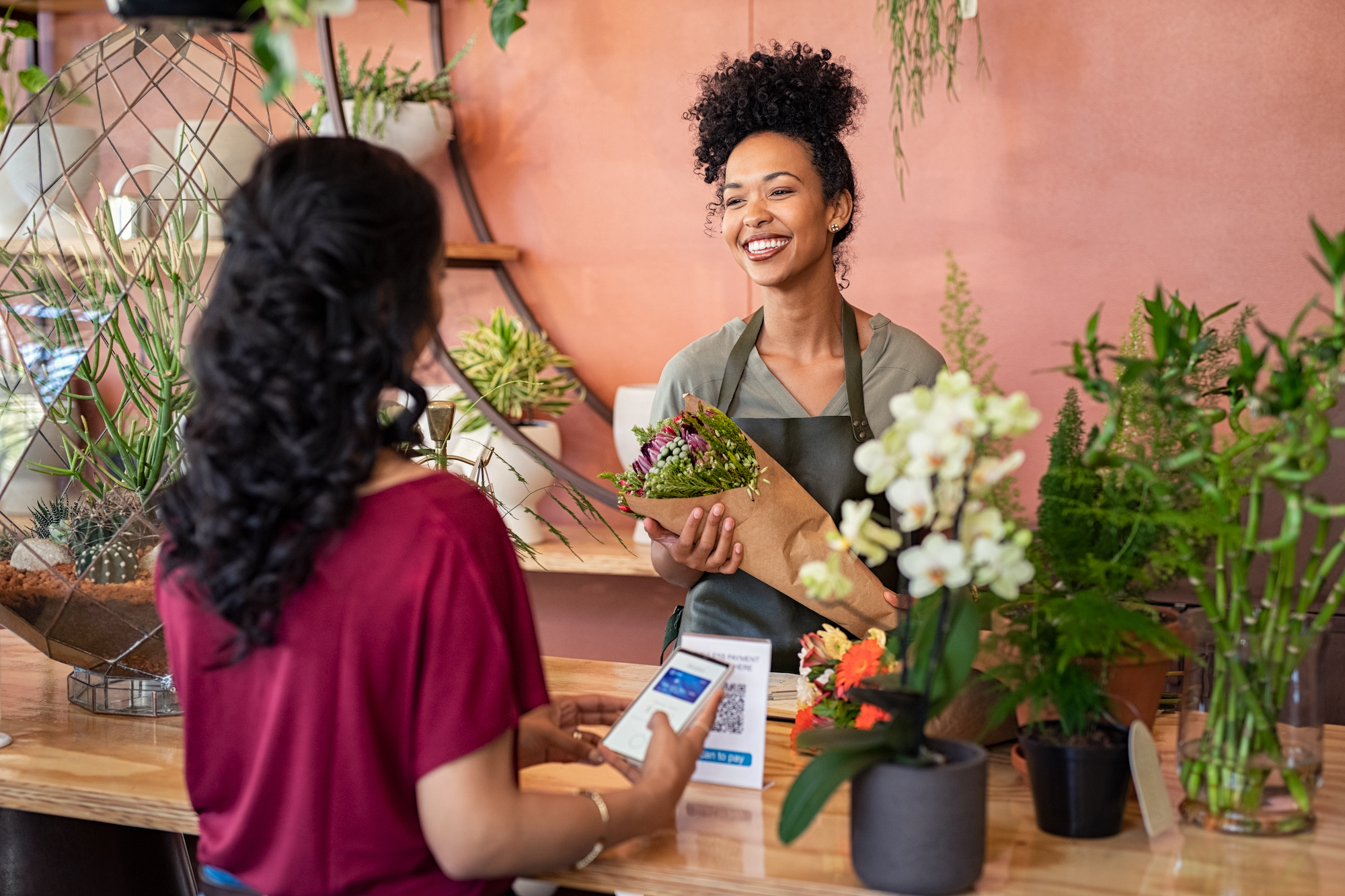 A florist is helping a customer