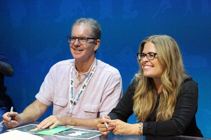 The directors of Frozen Fever, Chris Buck and Jennifer Lee, signing lithographs of the film's visual development art at D23 Expo in Anaheim, California on August 16, 2015.